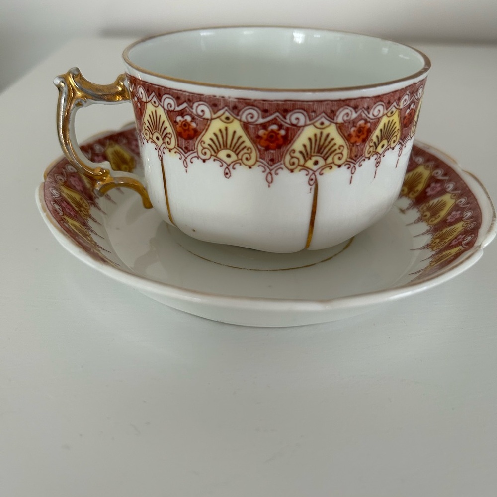 Elegant Gold and Red Teacup and Saucer Set